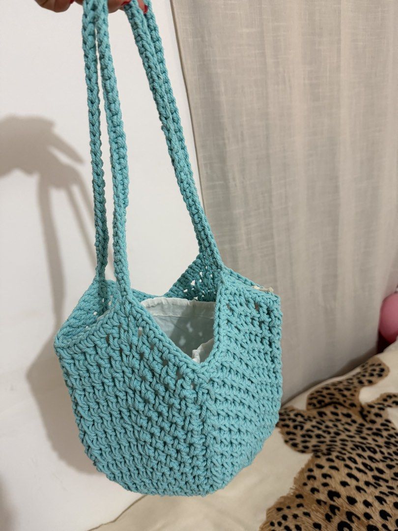 Light blue crochet shoulder bag with inner pouch (Category: Shoulder Bags) located in Manila. Submitted by mengxir20193848 (Listing ID 1465719381, Image 3). Description: - Handmade light blue crochet shoulder bag - Cozy chunky yarn knit pattern with sturdy matching straps - Includes a separate white cotton drawstring inner pouch for security - Perfect size for daily essentials: phone, wallet, and keys.