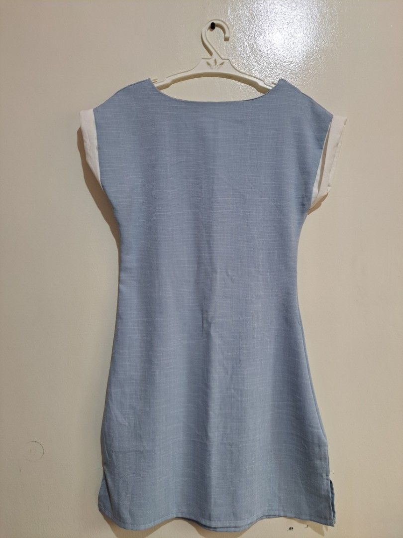 Light Blue Dress with White Cap Sleeves (Category: Dresses) located in Manila. Submitted by yselles__ (Listing ID 1465606389, Image 3). Description: - Design: Structured boat neckline and clean minimalist look - Length: Knee-length cut with a straight hem - Fabric: Textured material throughout - Occasion: Ideal for casual or smart-casual outings - Condition: Excellent, clean.