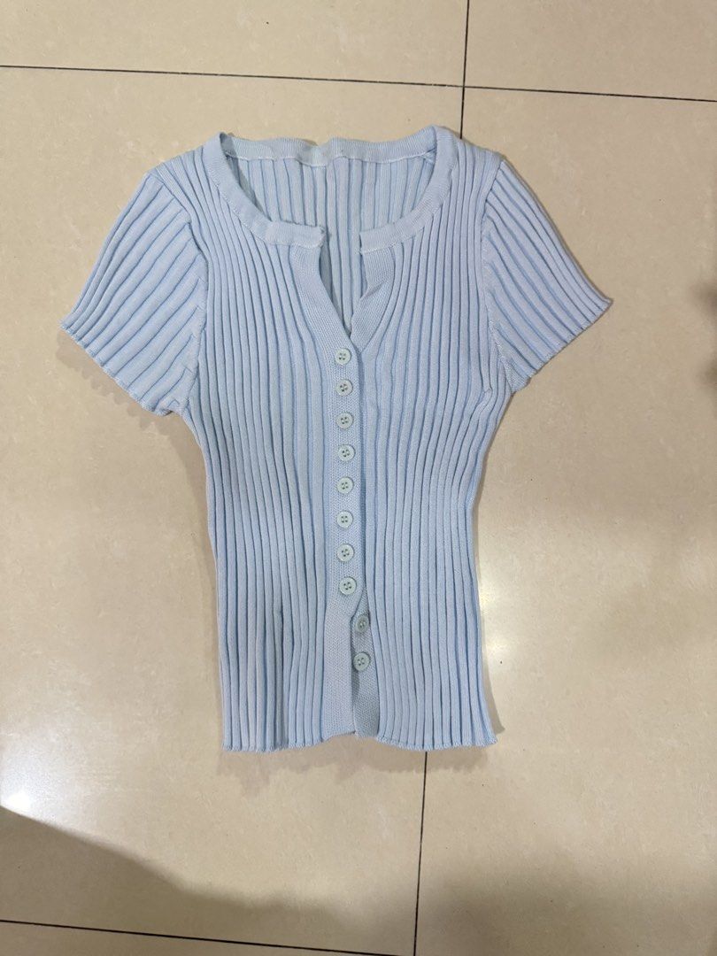 Light blue ribbed knit button-up top (Category: Longsleeves) located in Quezon City. Submitted by sweetlyluxe (Listing ID 1465602656, Image 1). Description: - Color: Light blue - Fabric: Stretchy vertical ribbed knit - Fit: Slim fit, short sleeve - Details: V-neckline with a row of front buttons - Condition: Clean, excellent pre-loved condition with no flaws - byeon woo seok fanmeet outfit.
