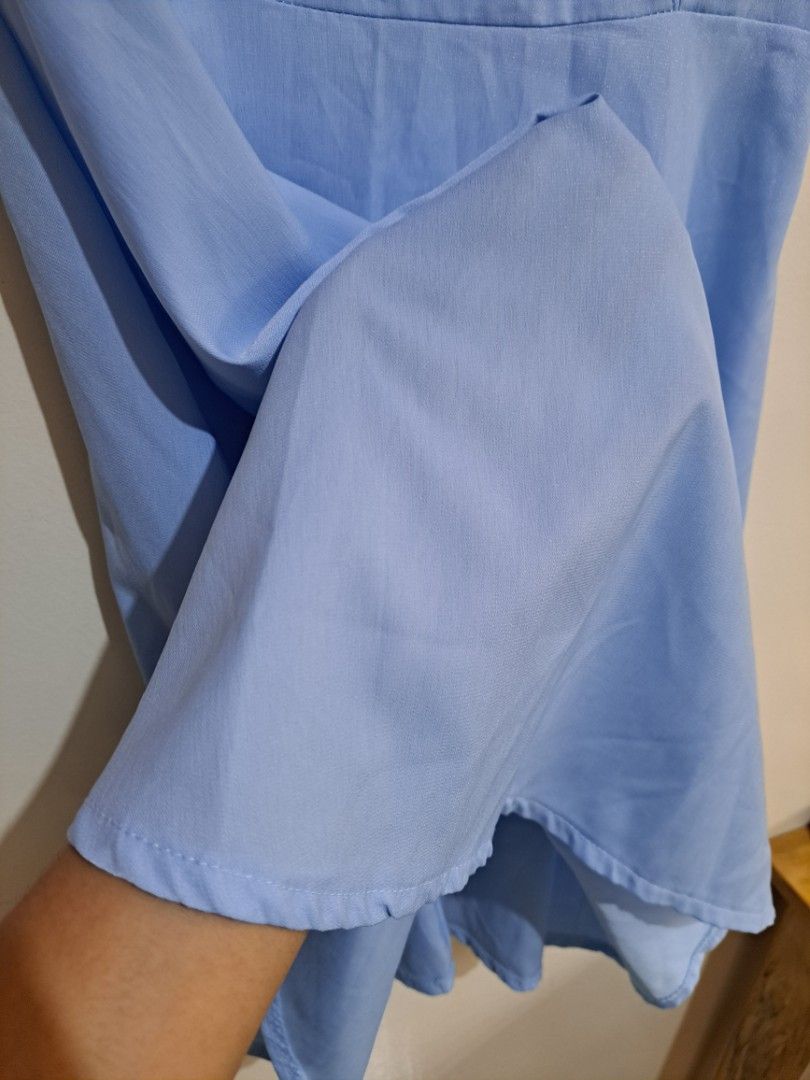 Light blue ruffle sleeve midi dress (Category: Dresses) located in Manila. Submitted by yselles__ (Listing ID 1465606392, Image 3). Description: - Style: Midi dress with cold shoulder cutouts and layered ruffle sleeves - Fit: Fitted waist with a flattering flared skirt silhouette - Closure: Convenient back zipper - Condition: Excellent, clean with no stains or damage - Perfect for: Casual outings, dates, and weekend events.