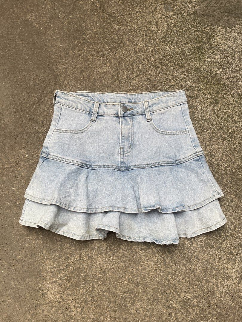 Light wash denim ruffle tiered skort shorts (Category: Skirts) located in Davao. Submitted by riab_qt (Listing ID 1465592525, Image 1). Description: - SIZE: 28” LENGTH: 14” - Style: Light blue denim skort with a Y2K casual vibe - Comfort: Built-in shorts underneath for worry-free wear - Design: Double-layered ruffle hem for a cute skirt look - Details: Front pockets, belt loops, and front button with zip fly closure - Versatility: Super easy to s