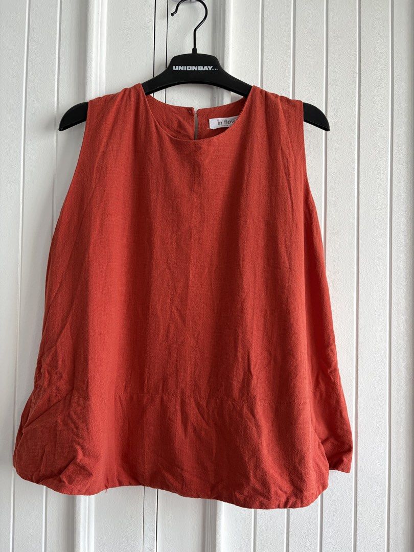 Linen In Flower Rust Orange Sleeveless Bubble Hem Top (Category: Sleeveless) located in Bacolod City. Submitted by francine_favss (Listing ID 1465598239, Image 1). Description: - Brand: In Flower - Color: Rust orange -Size: best fit to Medium or Large with smaller chest - Style: Sleeveless with a round neckline and structured bubble hem - Fit: Relaxed fit - Material: Textured cotton - Origin: Made in Thailand .
