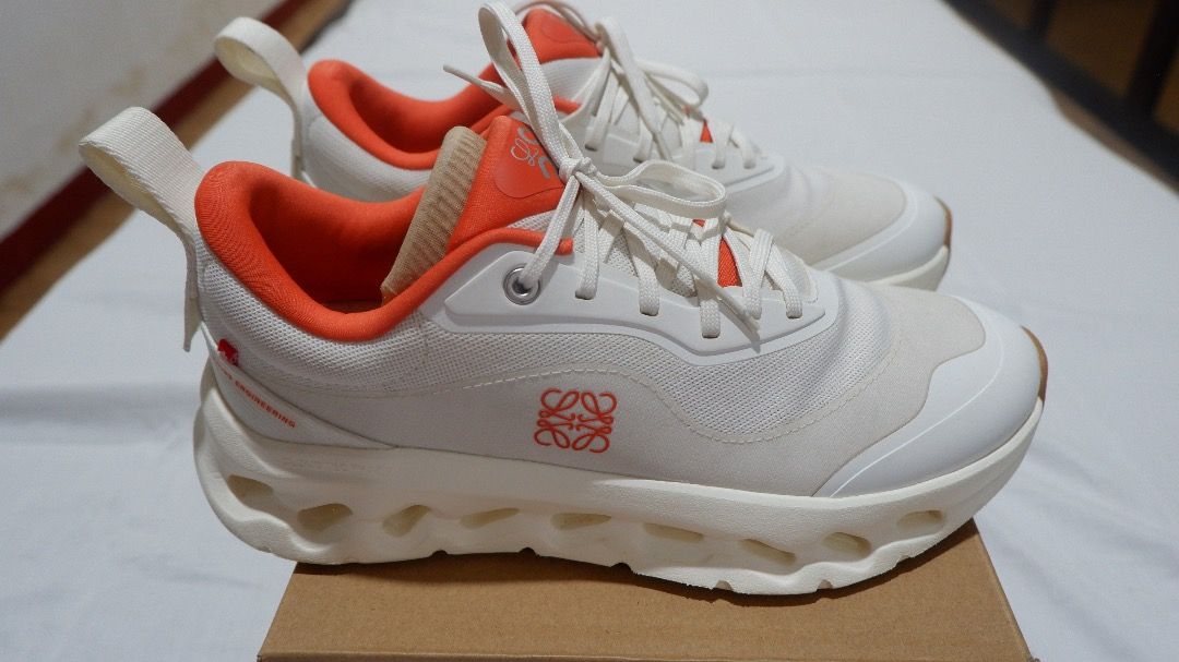 LOEWE × On Cloudtilt 2.0 - White/Orange (Category: Sneakers & Footwear) located in Malaybalay. Submitted by by.mady (Listing ID 1465688833, Image 2). Description: LOEWE × On Cloudtilt 2.0 — White/Orange Selling my personal pair. Used only a few times and still in very good condition. Size: Women’s US 8.5 / EU 40 / UK 6.5 / JP 25.5 Color: White / Orange On Style Code: 3WE10871562 LOEWE Style Code: L929282X29 Comes complete with original LOEWE × On