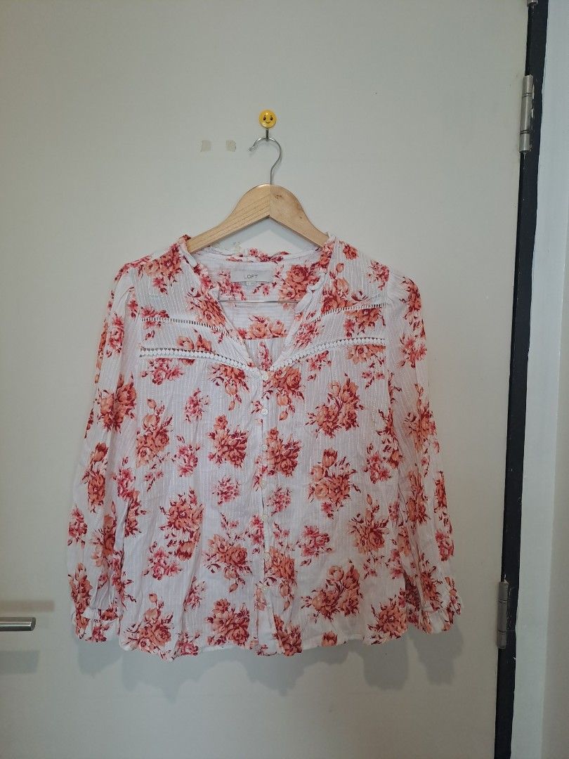 LOFT BY ANN TAYLOR FLORAL LONGSLEVE (Category: Longsleeves) located in Manila. Submitted by joanbalde39643 (Listing ID 1465671916, Image 1). Description: This item is a LOFT Bouquet Lacey Ruffle Cotton Blouse. It features a vibrant coral/pink floral pattern over a crisp white cotton fabric, detailed with delicate horizontal lace paneling across the chest, subtle vertical woven stripes, and an airy split neckline with a button-front closure..
