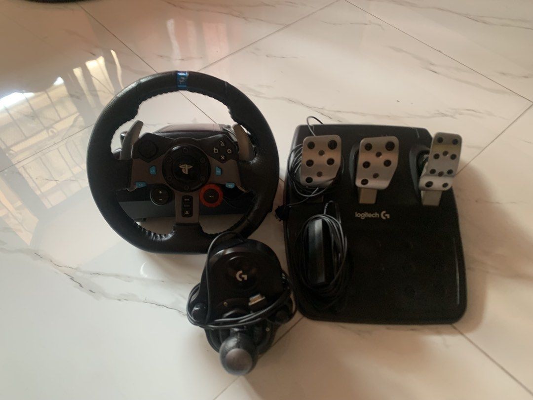 Logitech G29 Driving Force Racing Wheel and Pedals (Category: Controllers) located in Cavite. Submitted by cutesyyyy (Listing ID 1465583636, Image 2). Description: firm price already di ko na sinama price ng gear stick - Complete Logitech G29 racing setup (wheel, floor pedals, and 6-speed shifter) - Powerful dual-motor force feedback in great working condition - Premium hand-stitched leather steering wheel and stainless steel paddle shifters - Se