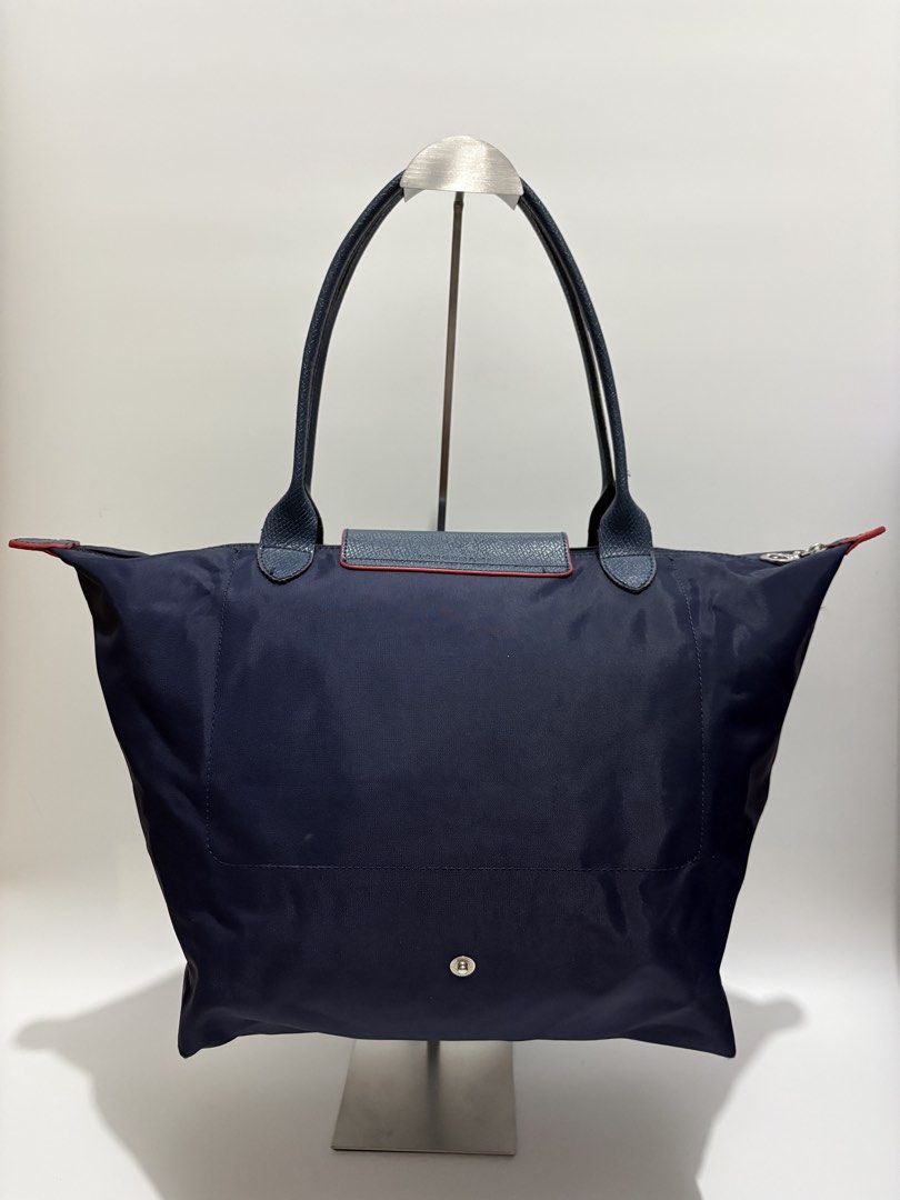 Longchamp Le Pliage Large Long Handle Tote Bag (Category: Tote Bags) located in Subic. Submitted by dear.jeveaph (Listing ID 1465651406, Image 2). Description: Longchamp Le Pliage Large Long Handle Tote Bag Not GA Still in great condition ₱ 700.00 Friendly reminder: This is a preloved bag. Please manage your expectations. If you want a flawless bag, buy one in the store. 😊.