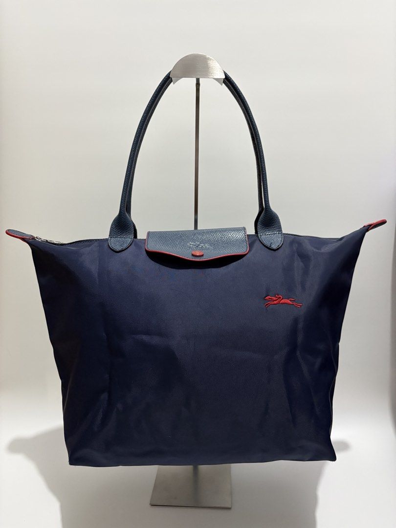 Longchamp Le Pliage Large Long Handle Tote Bag (Category: Tote Bags) located in Subic. Submitted by dear.jeveaph (Listing ID 1465651406, Image 1). Description: Longchamp Le Pliage Large Long Handle Tote Bag Not GA Still in great condition ₱ 700.00 Friendly reminder: This is a preloved bag. Please manage your expectations. If you want a flawless bag, buy one in the store. 😊.