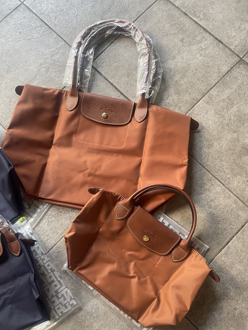 Longchamp Le Pliage Nylon Tote Bag Bundle (Category: Tote Bags) located in San Juan City. Submitted by queenielyu (Listing ID 1465581836, Image 2). Description: Gift from a friend for me and my daughter. Completely unused and kept as-is. the quality and craftsmanship are excellent. All text, stitching, and details are clearly shown in the photos. It‘s waterproof, lightweight, durable, and stain-resistant. Purely from a value-for-money perspective