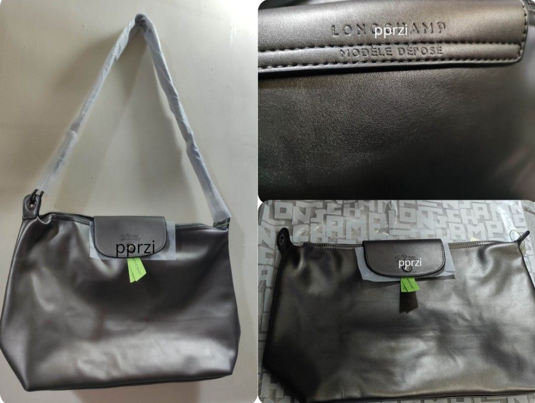 (10.10-15 sale ₱1,950+ free J&T) Longchamp Silver/Grey Hobo Bag (Category: Luxury Bags & Wallets) located in Quezon City. Submitted by pprzi_89 (Listing ID 1465697578, Image 1). Description: Top tier quality Soft leather Adjustable Shoulder/Crossbody Strap onhand: - Black - Silver/gray Other colors for pm.