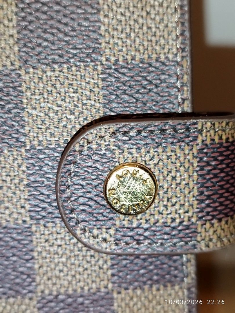 Louis Vuitton Damier Ebene Agenda Cover (Category: Luxury Bags & Wallets) located in Cebu City. Submitted by jplc24 (Listing ID 1465719772, Image 2). Description: - Louis Vuitton agenda cover in iconic Damier Ebene canvas - Model code R20240 - Secure snap button closure with polished gold-tone hardware - Standard planner ring binder mechanism inside - Features the classic Louis Vuitton Paris Made in France heat stamp - Excellent for daily plannin