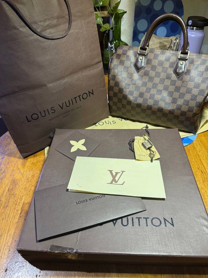 Louis Vuitton Damier Ebene Speedy 30 Handbag (Category: Luxury Bags & Wallets) located in Manila. Submitted by graaaaannny (Listing ID 1465601416, Image 1). Description: - Brand: Louis Vuitton - Model: Damier Ebene Handbag Speedy 30 - Color/Pattern: Brown Checkered Canvas - Hardware: Gold-tone - Handles: Double top handles - Customization: Subtle L.S. initials stamped on the front leather tab - Condition: Clean interior and corners, excellent ove
