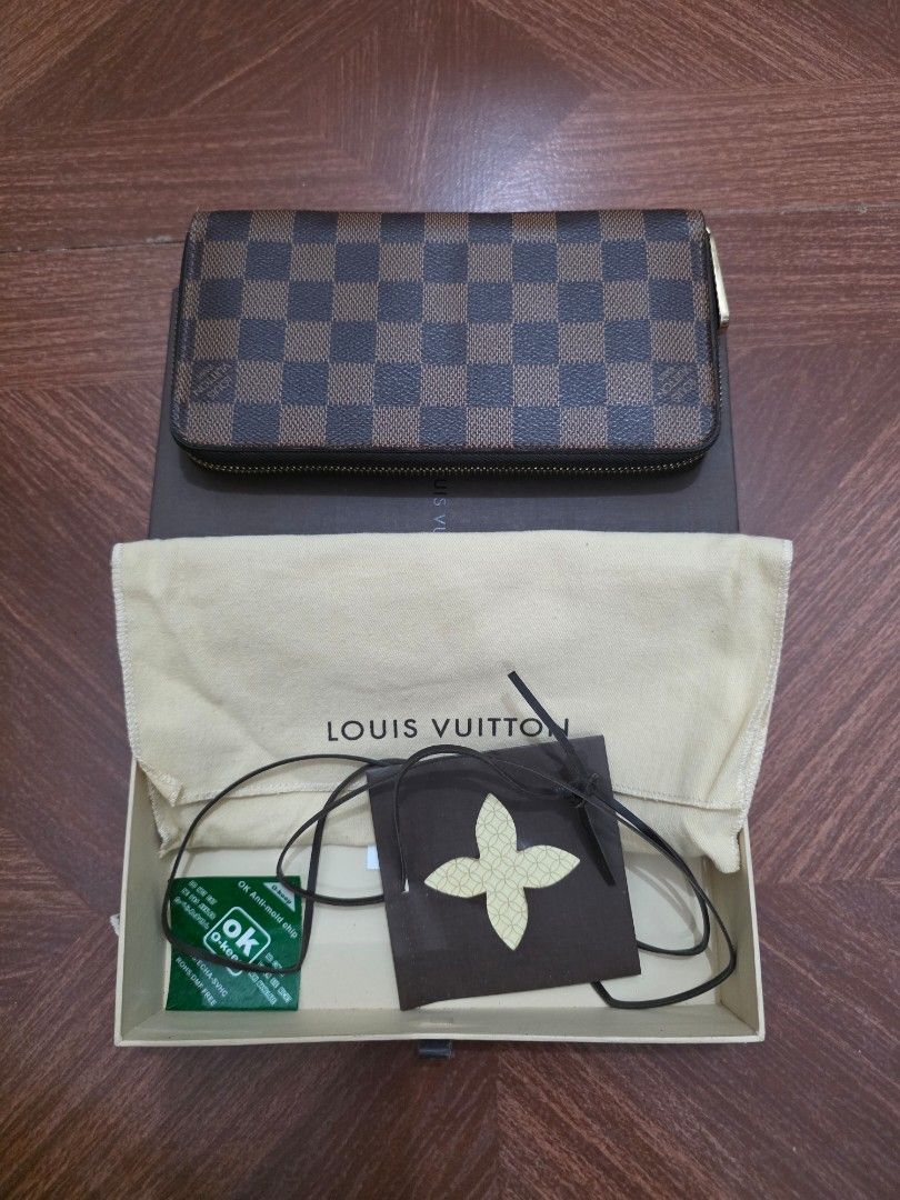 LOUIS VUITTON DAMIER EBENE ZIPPY WALLET (Category: Luxury Bags & Wallets) located in Manila. Submitted by everyallmustgo (Listing ID 1465747882, Image 2). Description: DAMIER EBENE ●Full-size zip-around ●Zippy-style wallet ●CA0125 date code ●Made in Spain ●Original box/dust bag from your earlier photos ●Interior appears reasonably well preserved.