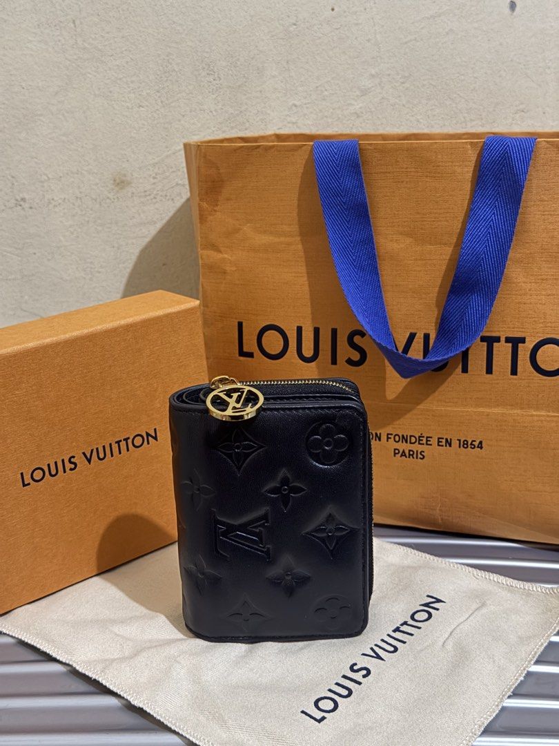 Louis Vuitton Monogram Empreinte Black Leather Zipped Wallet (Category: Luxury Bags & Wallets) located in Caloocan City. Submitted by ghlvllrmn391585 (Listing ID 1465693366, Image 2). Description: ORIGINAL LV WALLET 56,000 SRP USED ONCE THEN NADISPLAY NALANG - Authentic Louis Vuitton wallet in black leather with embossed monogram - Features gold-tone hardware and LV circle pull charm zipper - Interior includes multiple card slots and secure snap 