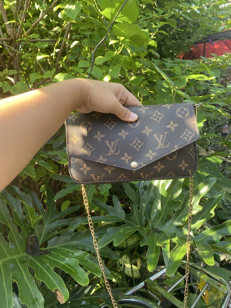 Louis Vuitton Monogram Envelope Chain Crossbody Bag (Category: Luxury Bags & Wallets) located in Manila. Submitted by cdb_22 (Listing ID 1465596832, Image 1). Description: - Classic monogram canvas body with dark brown leather trim - Elegant envelope flap design with gold-tone snap closure - Features an attached gold link chain for shoulder or crossbody wear - Structured, compact shape perfectly sized for your daily essentials.