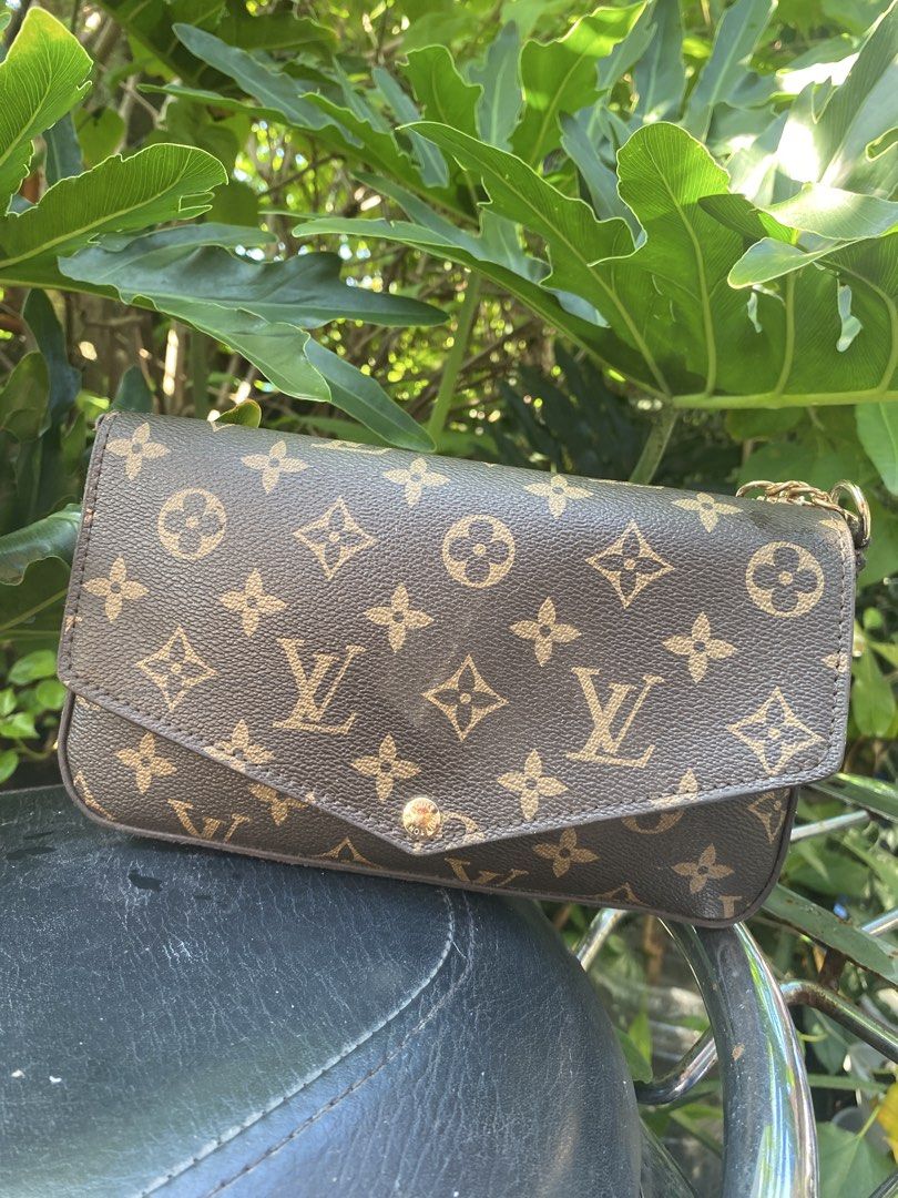 Louis Vuitton Monogram Envelope Chain Crossbody Bag (Category: Luxury Bags & Wallets) located in Manila. Submitted by cdb_22 (Listing ID 1465596832, Image 2). Description: - Classic monogram canvas body with dark brown leather trim - Elegant envelope flap design with gold-tone snap closure - Features an attached gold link chain for shoulder or crossbody wear - Structured, compact shape perfectly sized for your daily essentials.