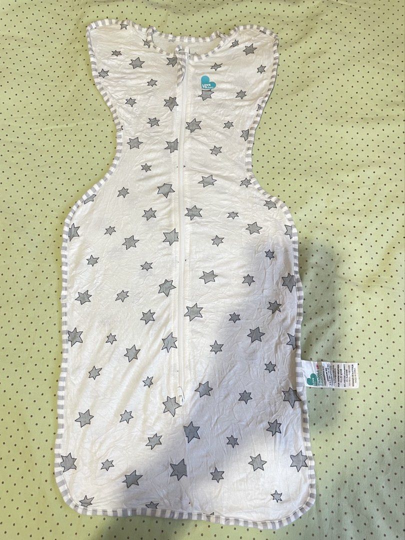 Love To Dream Swaddle UP Bundle (4 pieces) (Category: Breastfeeding & Bottle Feeding) located in San Jose del Monte. Submitted by momma_buys (Listing ID 1465599048, Image 3). Description: - Bundle of 4 Love To Dream swaddles - Designs: Grey, blue geometric triangles, white with grey stars, and white with yellow moons & stars - Features two-way zippers for hassle-free diaper changes - Soft, stretchy fabric that promotes the natural arms-up sleepin
