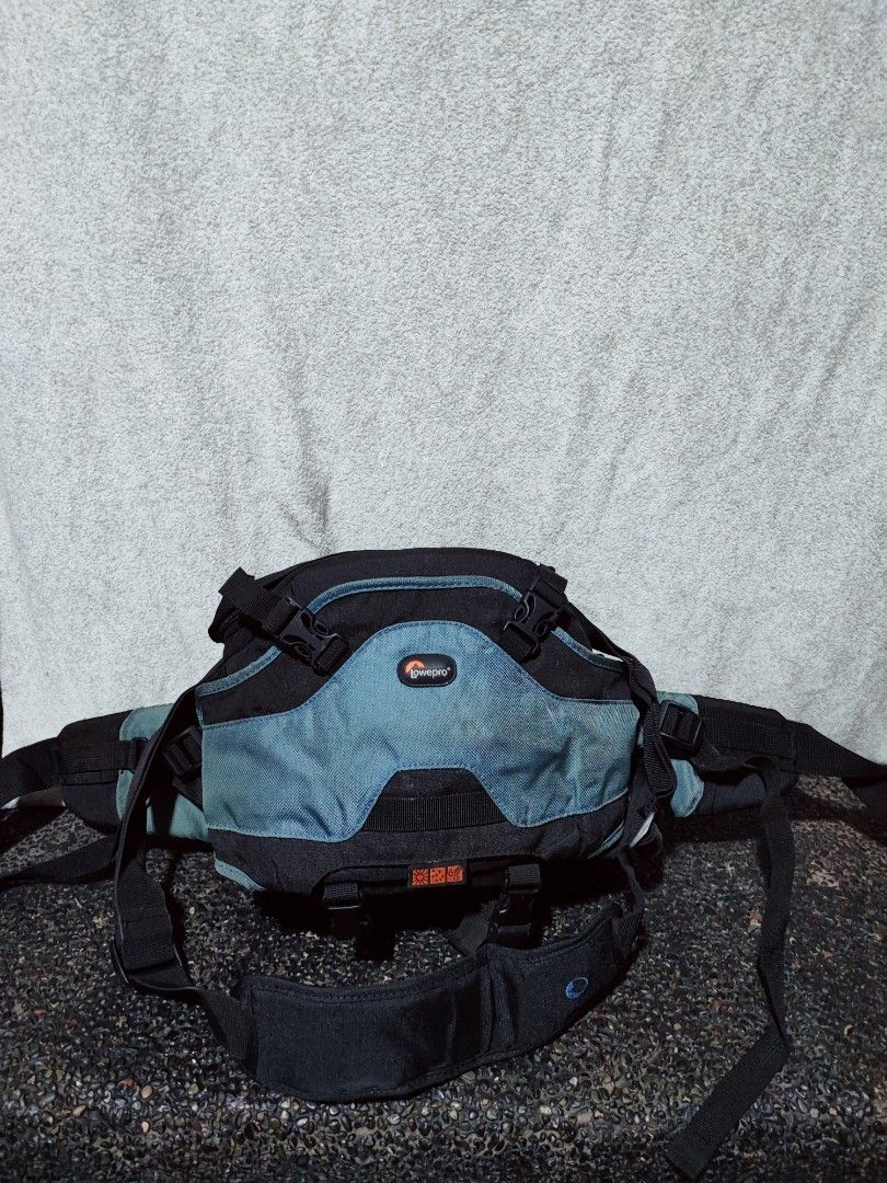 Lowepro camera waist bag with shoulder strap (Category: Camera Bags & Carriers) located in Baguio. Submitted by ozara.06 (Listing ID 1465696847, Image 1). Description: Lowepro Inverse 100 AW Camera Beltpack Capacity: 1 pro DSLR with medium zoom lens attached plus 1 additional lens or flash unit; charger and cords; filters and memory cards In very good condition with rain cover 1k.