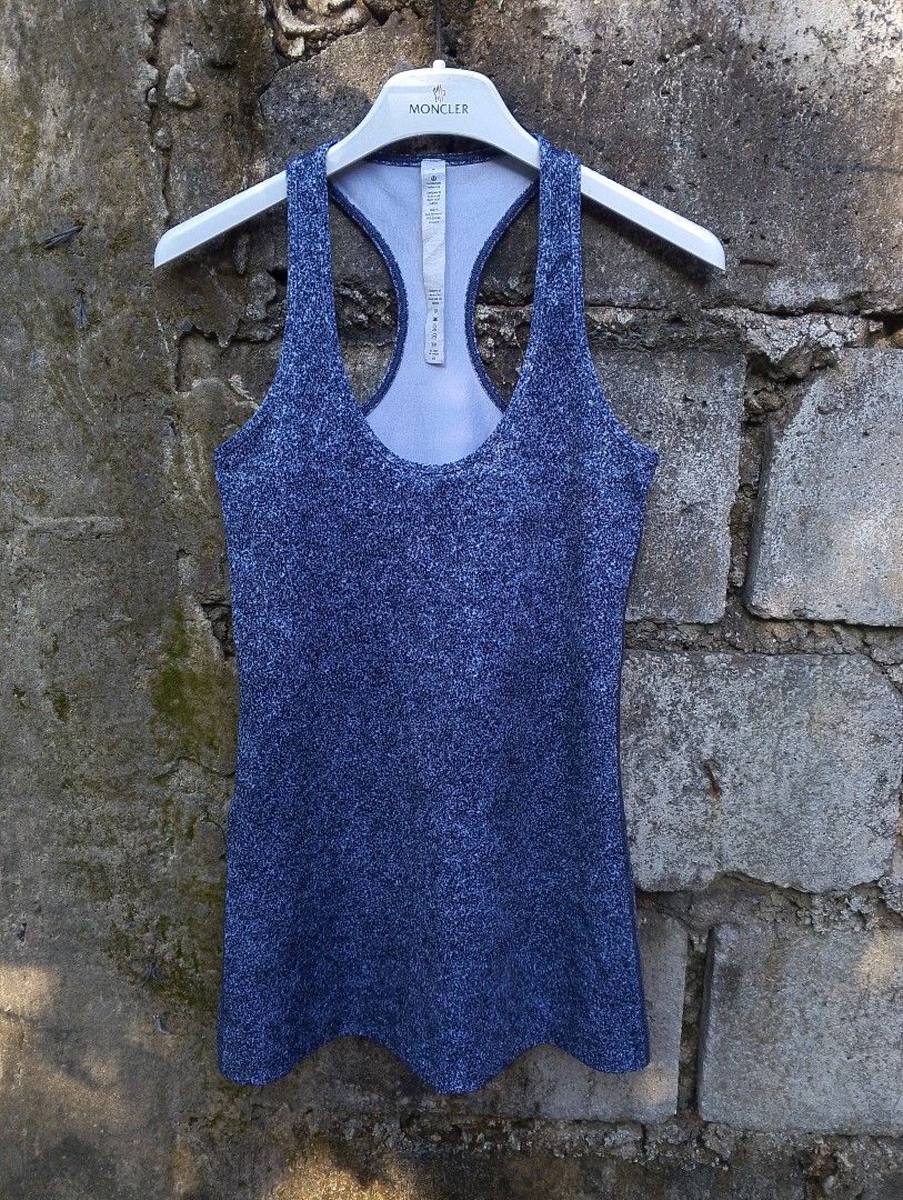 Lululemon Athletica Racerback Tank Top (Category: Activewear) located in Baliuag. Submitted by retrovault83 (Listing ID 1465675220, Image 1). Description: ✨ Condition: 9/10 – Excellent Preloved Condition 📏 Measurements (Flat Lay, Tagged Size 4): • Width: 24 - 26 • Length: 26 ✅ Details: • Authentic Lululemon Athletica racerback tank top • Heathered / speckled navy blue activewear fabric • Signature metallic silver Lululemon logo on upper back • S
