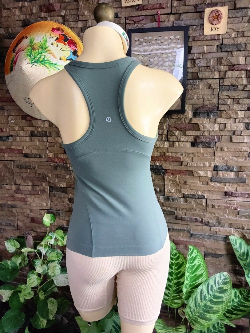 Lululemon Tank Top (Category: Activewear) located in Rizal. Submitted by timeless_shop (Listing ID 1465579752, Image 3). Description: ORIGINAL Lululemon Align Racerback Tank Top - Dark Forest - Size 6 👚 Fit to Small to Medium Frame Bust Size 32-34 🎨 Color: Dark Forest / Sage Green 🧵 Material: Nulu Fabric - buttery soft, lightweight, 4-way stretch 💯 Condition: 9.8/10 - Like New! 🎨 Color Rate: 9.8/10 - Hindi kupas, walang himulmol - Maayos at 