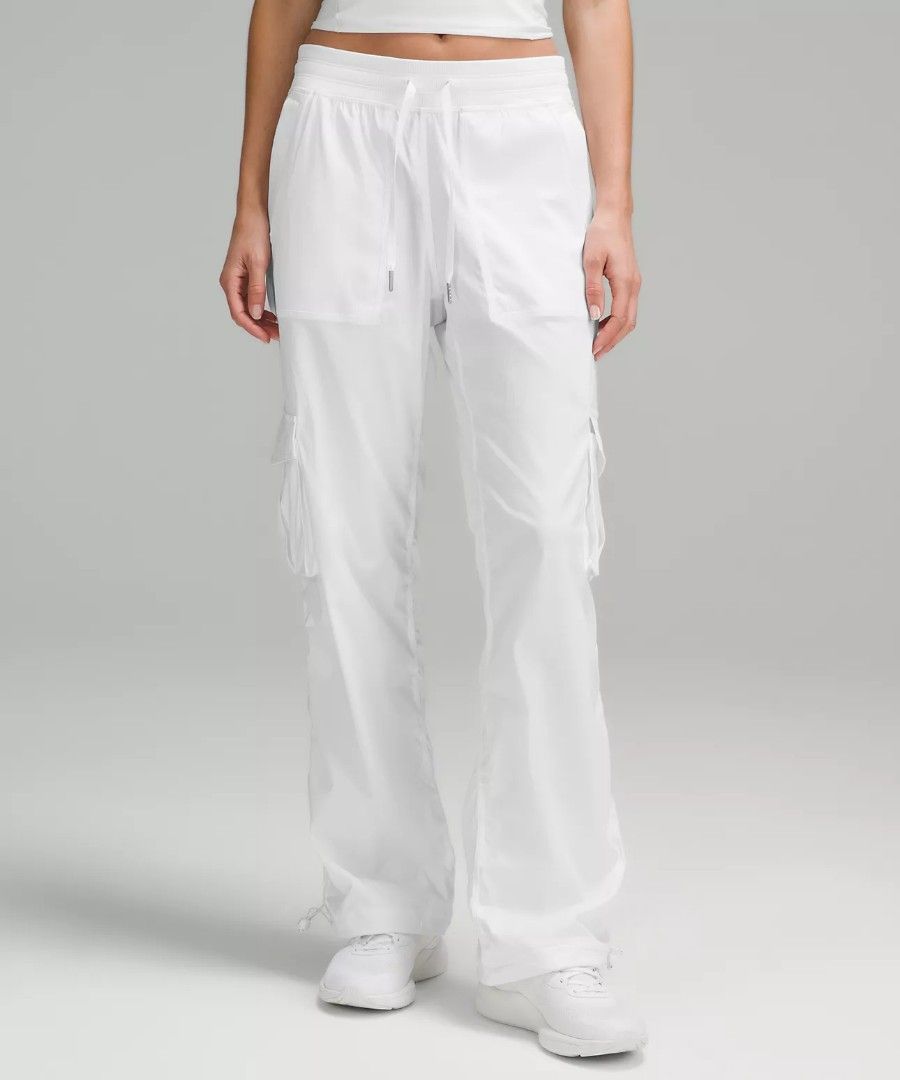 Lululemon White Cargo Pants (Category: Jeans) located in Manila. Submitted by royalrabbit.7b2a11 (Listing ID 1465715790, Image 1). Description: - Brand: Lululemon - Color: White - Fit: Relaxed fit with gathered side details - Material: Lightweight fabric, ideal for workouts or casual wear - Features: Multiple utility pockets for functionality - Adjustability: Drawstrings at the waist and hems for a customized fit.