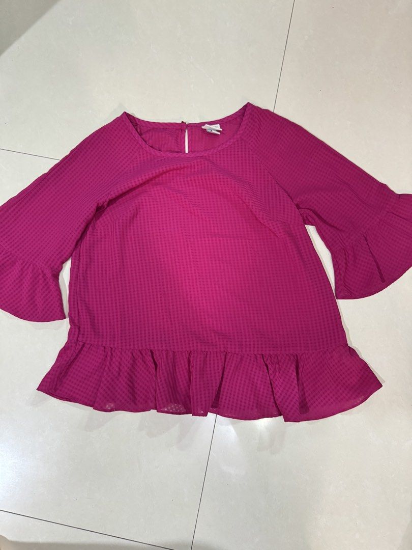 Magenta Bell Sleeve Ruffle Hem Blouse (Category: Blouses) located in Quezon City. Submitted by sweetlyluxe (Listing ID 1465620835, Image 1). Description: - Color: Magenta pink with subtle check pattern - Size: XS - Design: Bell sleeves, ruffled hem, and back keyhole button closure - Material: Lightweight and comfortable .