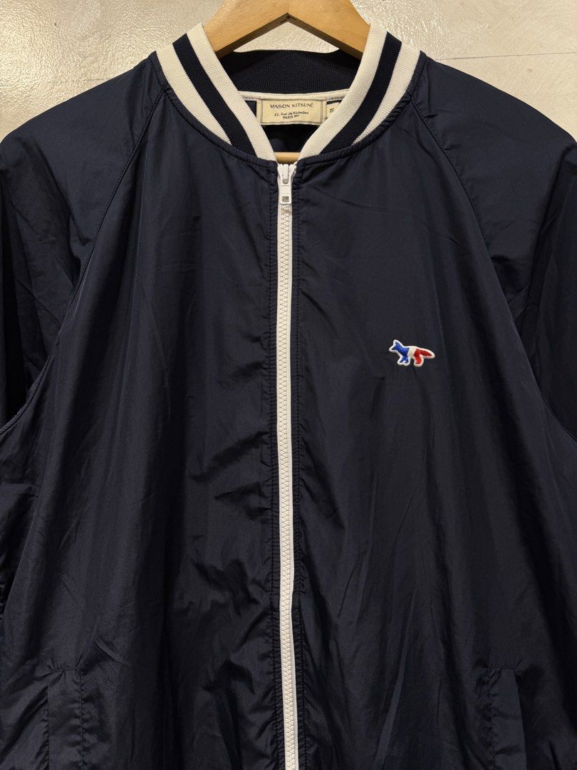 Maison Kitsune Fox Logo Varsity Jacket (Category: Coats, Jackets and Outerwear) located in Makati City. Submitted by dailypickups_ (Listing ID 1465687213, Image 2). Description: Size: M In excellent condition Made in: Portugal Material: 100% Polyester Dimensions Width: 21.5” Length: 27.5”.