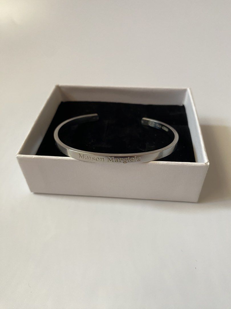 Maison Margiela Bangle (Category: Bracelets) located in Manila. Submitted by ecruos.s (Listing ID 1465620766, Image 1). Description: silver sterling engraved logo.