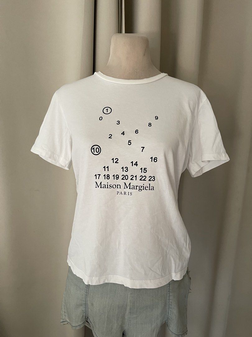Maison tee (Category: Shirts) located in Cainta. Submitted by zlove111 (Listing ID 1465583898, Image 1). Description: no washtags medium - Features iconic circled and numbered brand graphic on the chest - Made from premium, soft cotton for all-day comfort - Classic crew neckline with a standard fit - Versatile everyday basic piece, easy to style - Condition: Brand new/Mint (Ready to ship).