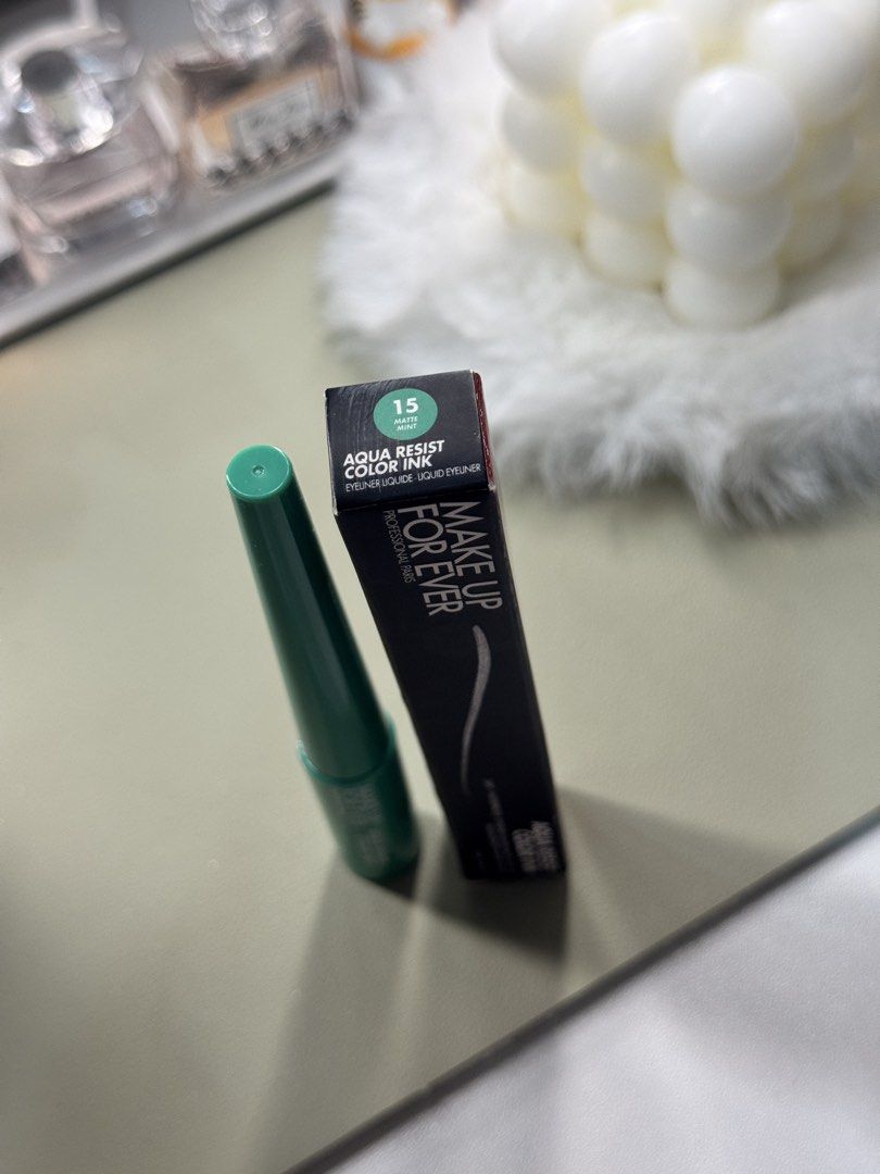 Make Up For Ever Aqua Resist Color Ink Matte Mint (Category: Makeup) located in Binan City. Submitted by seoulbeauty_cart (Listing ID 1465586528, Image 2). Description: - Brand: Make Up For Ever - Product: Aqua Resist Color Ink Liquid Eyeliner - Shade: 15 Matte Mint (pastel mint green) - Size: 2 ml - Condition: Brand new, unopened box - Features: High intensity, 24-hour waterproof formula - Ideal for: Creative makeup looks and artistic eye art.