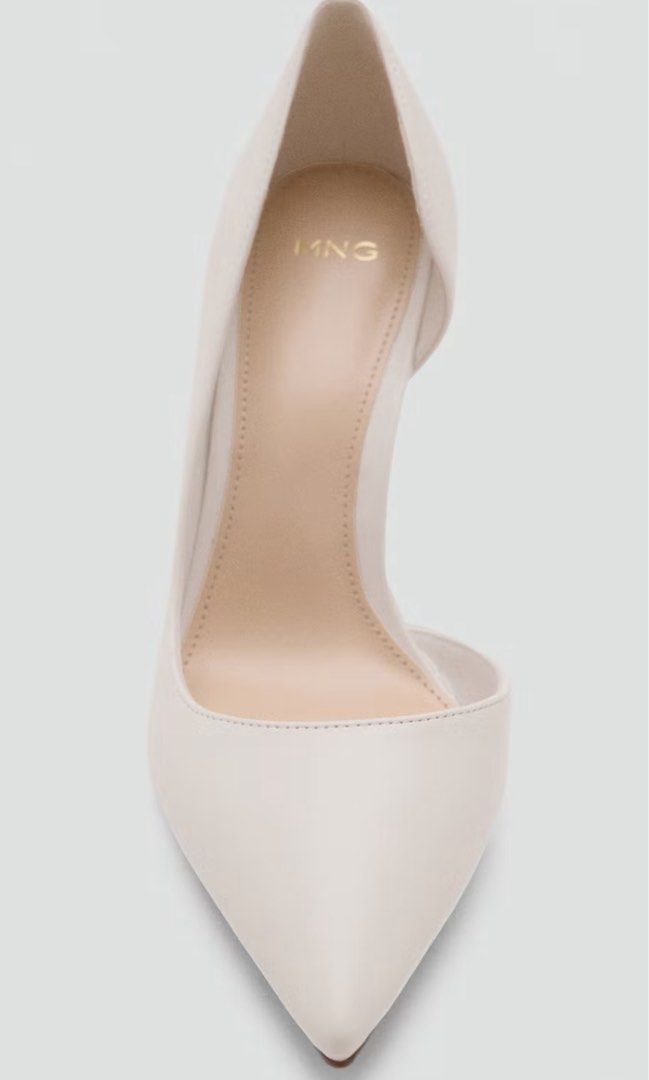 MANGO Asymmetric Stiletto Shoes White (Category: Heels) located in Davao. Submitted by oh.cake (Listing ID 1465683019, Image 3). Description: - Brand: Mango - Style: White asymmetric stiletto shoes with modern silhouette - Features: Pointed toe, slim high heel, and stylish side cutout - Sizing: Standard Mango sizing - Occasions: Ideal for parties, dinners, and formal events RFS: decluttering Price is negotiable if you're sure about taking the ite