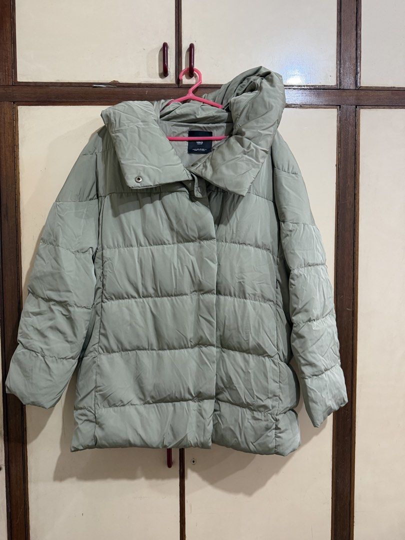 Mango Basics Sage Green Puffer Winter Jacket size Small (Category: Coats, Jackets and Outerwear) located in Manila. Submitted by preloved_new_forsale (Listing ID 1465635650, Image 1). Description: - Brand: MNG Basics - Color: Trendy sage green (neutral earthy tone) - Size: EUR S / USA XS / MEX CH - Design: Quilted horizontal pattern with high funnel neck and snap button closure - Fit: Oversized fit with long sleeves - Condition/Origin: Made in My