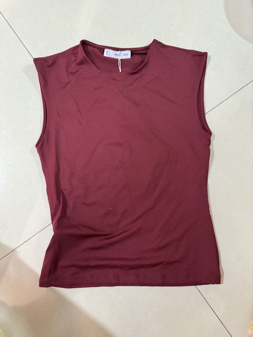 Mango Maroon Sleeveless Top for birthdays parties (Category: Sleeveless) located in Quezon City. Submitted by sweetlyluxe (Listing ID 1465601596, Image 1). Description: - Brand: Mango - Condition: Brand New with Tags (BNWT) - Size: S - Color: Maroon - Style: Sleeveless top with crew neckline and straight hem - Material: Smooth and stretchy fabric.