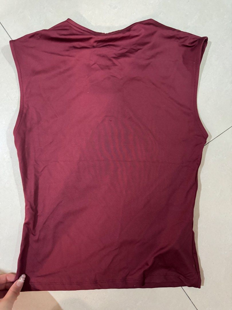 Mango Maroon Sleeveless Top for birthdays parties (Category: Sleeveless) located in Quezon City. Submitted by sweetlyluxe (Listing ID 1465601596, Image 3). Description: - Brand: Mango - Condition: Brand New with Tags (BNWT) - Size: S - Color: Maroon - Style: Sleeveless top with crew neckline and straight hem - Material: Smooth and stretchy fabric.