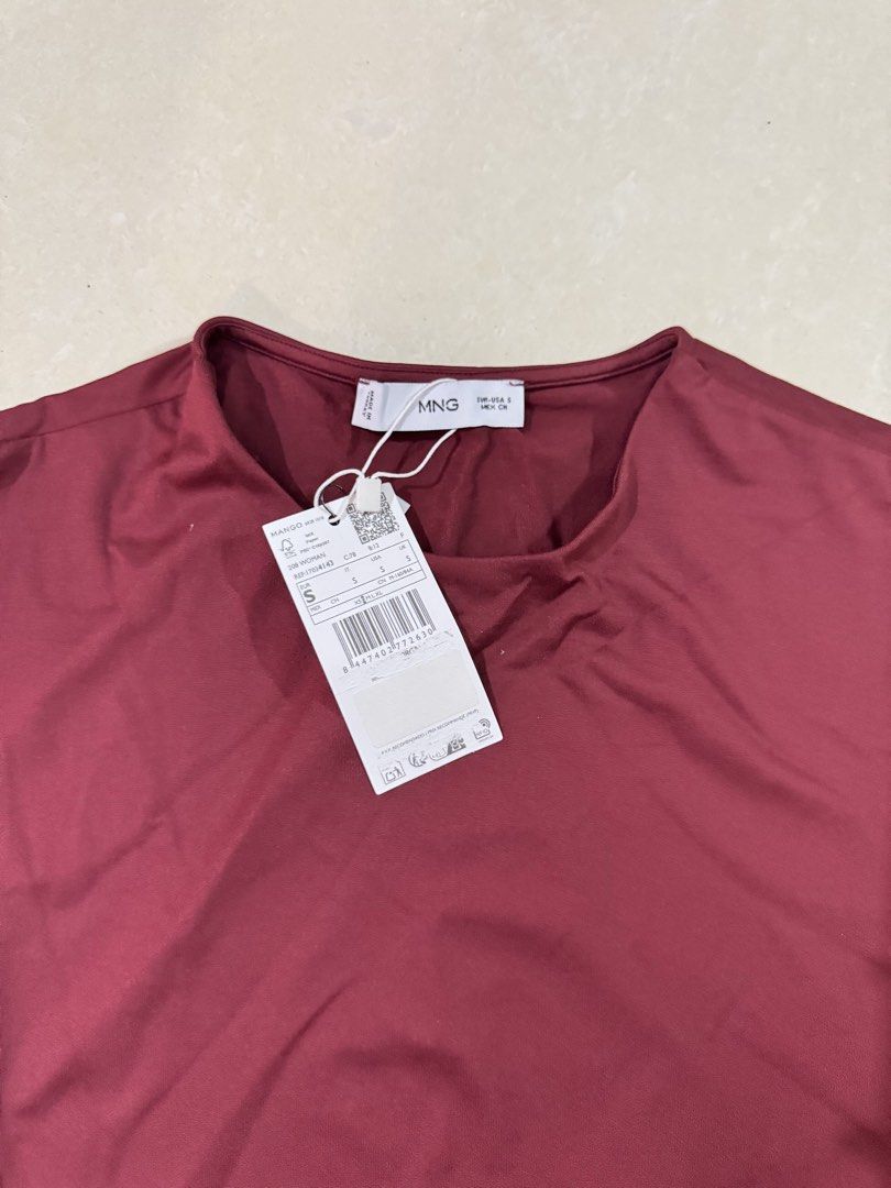 Mango Maroon Sleeveless Top for birthdays parties (Category: Sleeveless) located in Quezon City. Submitted by sweetlyluxe (Listing ID 1465601596, Image 2). Description: - Brand: Mango - Condition: Brand New with Tags (BNWT) - Size: S - Color: Maroon - Style: Sleeveless top with crew neckline and straight hem - Material: Smooth and stretchy fabric.