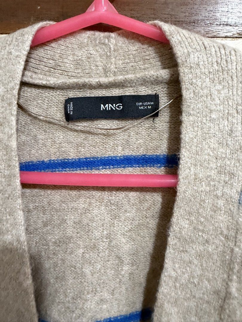 Mango MNG Striped Oversized Cardigan Medium (Category: Coats, Jackets and Outerwear) located in Manila. Submitted by preloved_new_forsale (Listing ID 1465637839, Image 3). Description: - Brand: MNG - Size: M - Color: Beige with bright blue horizontal stripes - Style: Open-front V-neck cardigan with tortoiseshell buttons - Details: Two front patch pockets, long sleeves, ribbed cuffs and hem - Fit: Relaxed and slouchy - Origin: Made in China.