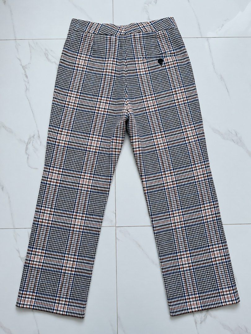 Mango Suit Plaid Pants EUR 34 (Category: Other Bottoms) located in Quezon City. Submitted by poshforward (Listing ID 1465661172, Image 2). Description: - Brand: Mango Suit - Pattern: Classic plaid (black, white, blue, and brown tones) - Fit: Tailored fit with a structured waistband - Details: Front zip closure, single dark button on the back pocket, clean inner lining - Origin: Made in Morocco - Condition: Excellent pre-loved condition (ready to 