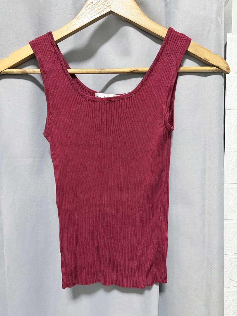 Maroon Ribbed Knit Tank Top Scoop Neck (Category: Sleeveless) located in Manila. Submitted by saichyy (Listing ID 1465663521, Image 1). Description: - Color: Maroon - Material: Stretchable ribbed knit that hugs the body nicely - Design: Scoop neckline and classic wide straps - Hemline: Straight hem at the bottom - Styling: Versatile basic, easy to match with jeans or skirts for daily wear.