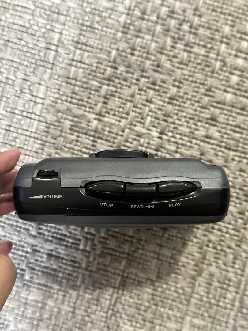 Matsui BBF 9 AM/FM Cassette Player (working) (Category: Portable Music Players) located in Manila. Submitted by cccatipiinera (Listing ID 1465607355, Image 2). Description: - Model: Matsui BBF 9 portable cassette player - Features: AM/FM radio with built-in analog tuner and Bass Boost System - Controls: Top-edge volume wheel, play, fast forward, and stop buttons - Design: Sleek dark grey plastic body - Condition: Tested, working, and ready to use