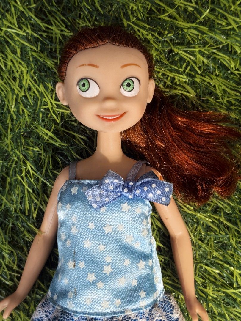 1987 Mattel Jessie Doll 25cm (Category: Figurines & Statues) located in Paranaque City. Submitted by furugiyafinds (Listing ID 1465634450, Image 2). Description: - Brand/Marking: Mattel Inc 1987 China stamp on back - Appearance: Vibrant red hair in a side ponytail and braids, expressive green eyes - Outfit: Light blue dress with white stars, lace trim, and a matching neckline bow - Condition: Good overall, with minor dirt marks on the back of the