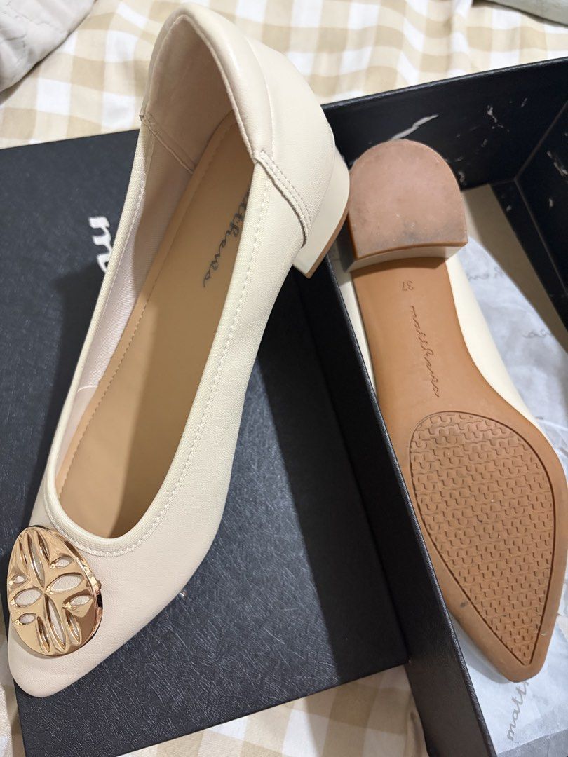 Matthews Roger Cream Pointed Toe Flats Size 37 (Category: Flats & Sandals) located in Caloocan City. Submitted by mllndg (Listing ID 1465706846, Image 3). Description: - Brand: Matthews - Style: Pointed flats with low block heel - Color: Cream with gold-tone decorative toe medallion - Size: 37 (marked inside and on sole) - Condition: Worn once, very minor wear on soles - Inclusions: Original black shoebox.