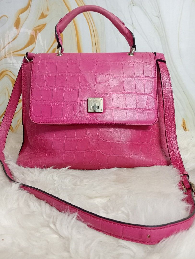 MCM Pink Crocodile Embossed Leather Satchel (Category: Luxury Bags & Wallets) located in Cabadbaran. Submitted by lioness_cave (Listing ID 1465737242, Image 1). Description: - Brand: MCM München - Material: Bright pink embossed leather with crocodile pattern texture - Hardware: Silver-tone with MCM logo stamping on the front lock, zipper pull, and interior plate - Interior: Grey fabric lining with serial number D9486 stamped on the metal plaque -