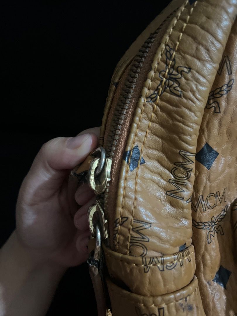MCM Visetos Monogram Backpack Cognac (Category: Luxury Bags & Wallets) located in Caloocan City. Submitted by rosh1923 (Listing ID 1465656852, Image 3). Description: - Authentic classic MCM backpack in signature cognac brown monogram - Elegant gold-toned hardware with stylish side stud details - Convenient front zippered pocket for easy access - Spacious interior with black lining, MCM München logo plaque, and Made in Korea tag - Smooth-working z