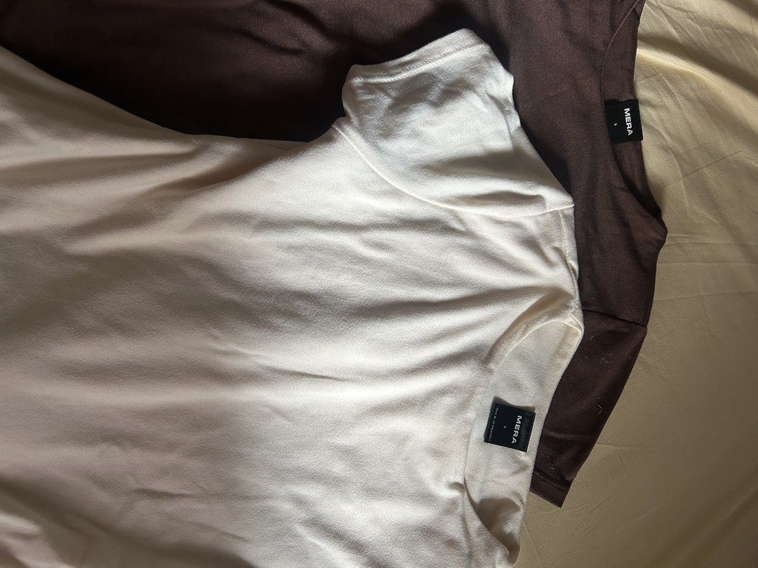 Mera T-Shirts White and Brown Size S (Category: Shirts) located in Marikina City. Submitted by sunoo00 (Listing ID 1465588876, Image 1). Description: - Brand: Mera - Set: 2 T-shirts (White and Brown) - Size: Small - Material: Soft knit fabric - Fit: Regular - Details: Round neckline, black brand label at the collar - Option: Buy as a bundle or individual pieces - Inquiries: Message for more details.