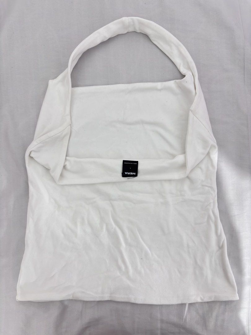 White Halter Top (Category: Others Tops) located in Manila. Submitted by niellaeun (Listing ID 1465752403, Image 2). Description: Used once Size: Large on tag (stretchable) can fit to xl Bust: 36-38 .