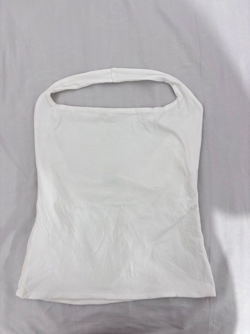 White Halter Top (Category: Others Tops) located in Manila. Submitted by niellaeun (Listing ID 1465752403, Image 1). Description: Used once Size: Large on tag (stretchable) can fit to xl Bust: 36-38 .