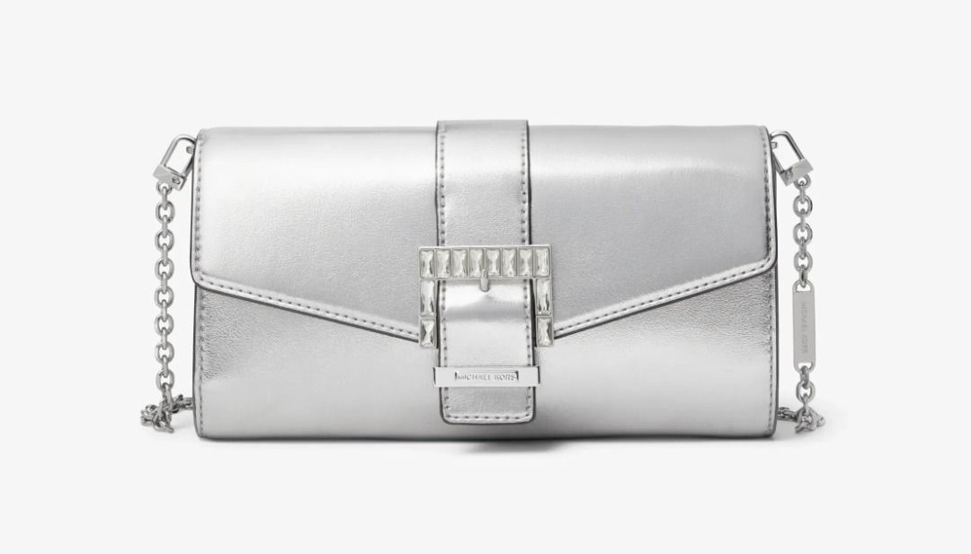Michael Kors Penelope Medium Silver Clutch $258 BNWT Formal (Category: Luxury Bags & Wallets) located in Las Pinas. Submitted by anonymously_shopaholic (Listing ID 1465721535, Image 3). Description: Brand new with tags but the silver chain strap was misplaced, so this is just the clutch bag. - Brand: Michael Kors - Style: Penelope Medium Clutch - Color/Finish: Silver Metallic - Features: Crystal-embellished buckle closure, removable chain strap f