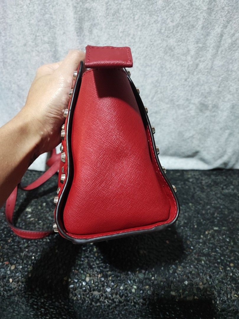 Michael Kors Red Studded Crossbody Bag (Category: Cross-body Bags) located in Baguio. Submitted by ozara.06 (Listing ID 1465699739, Image 2). Description: Michael kors Small size May rubs sa bandang end ng zipper Very nice nya 1k.