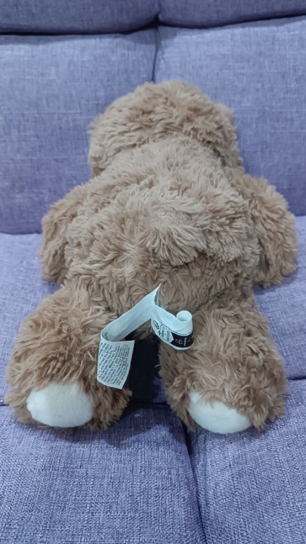 Miniso Brown Teddy Bear Plush Toy (Category: Plushies & Soft Toys) located in Quezon City. Submitted by fabricatebycp (Listing ID 1465730612, Image 2). Description: Fluffy brown teddy bear from Miniso. White snout, brown embroidered nose, and white paw pads. Measures 25cm / 10 inches tall. Tag still attached to the back. Soft plush material, super cuddly..