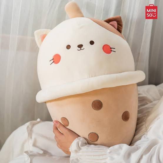 Cat milk tea plush pillow soft stuffed toy (Category: Plushies & Soft Toys) located in Mandaluyong City. Submitted by catpuccinoxo (Listing ID 1465717920, Image 1). Description: Bought from Miniso - Large Milktea Cat plushie (approx. 35-40 tall x 20cm wide) - Made with super soft, fluffy fabric that's great for hugging rfs: no longer sparks joy loc: mandaluyong.