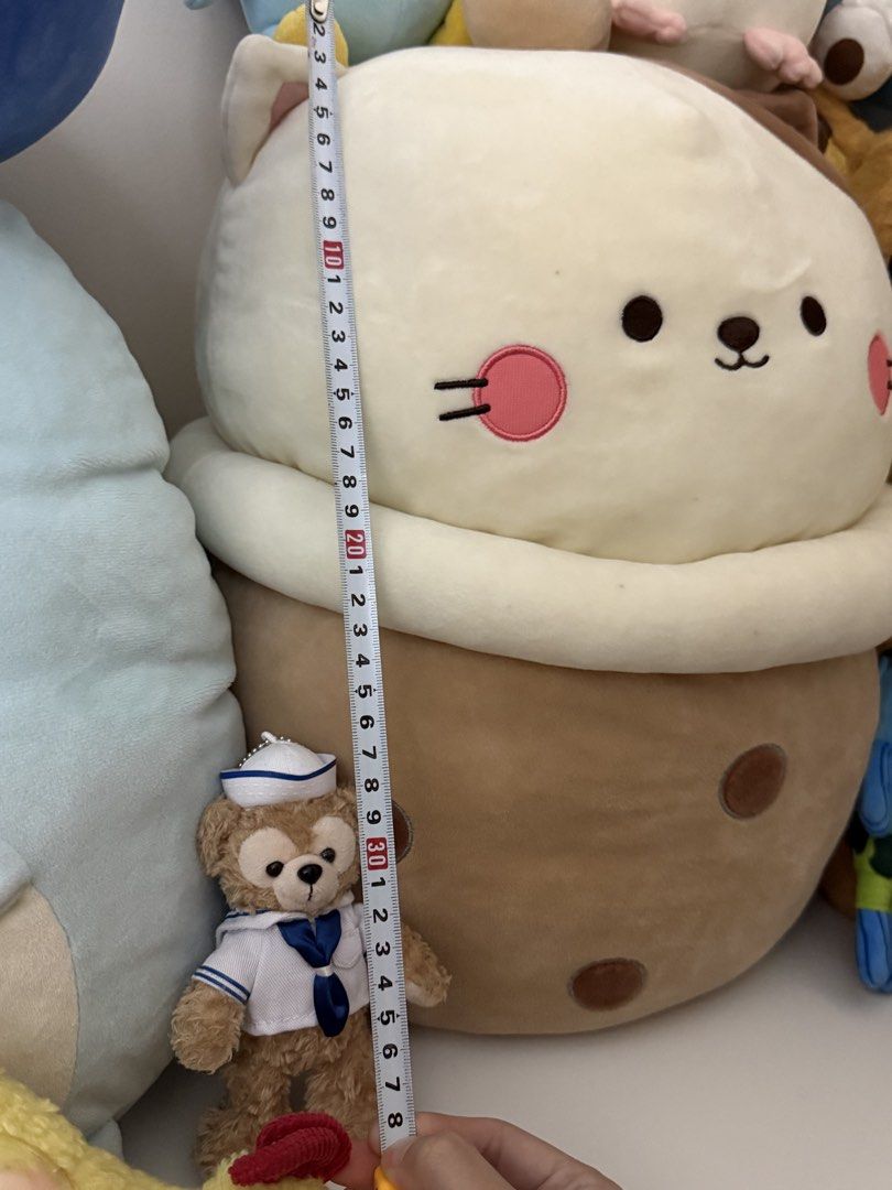 Cat milk tea plush pillow soft stuffed toy (Category: Plushies & Soft Toys) located in Mandaluyong City. Submitted by catpuccinoxo (Listing ID 1465717920, Image 3). Description: Bought from Miniso - Large Milktea Cat plushie (approx. 35-40 tall x 20cm wide) - Made with super soft, fluffy fabric that's great for hugging rfs: no longer sparks joy loc: mandaluyong.